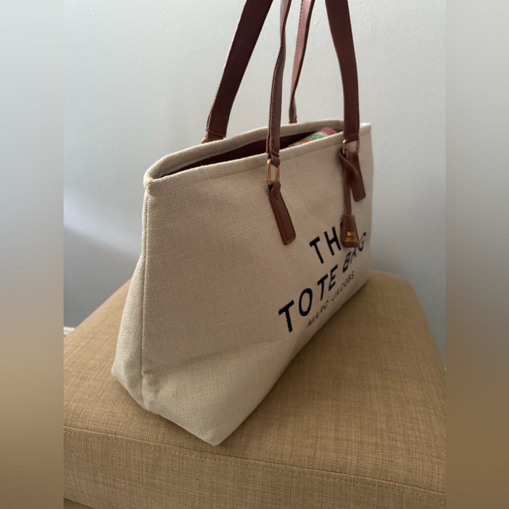 Beige Canvas Tote with Brown Leather Handles and Logo